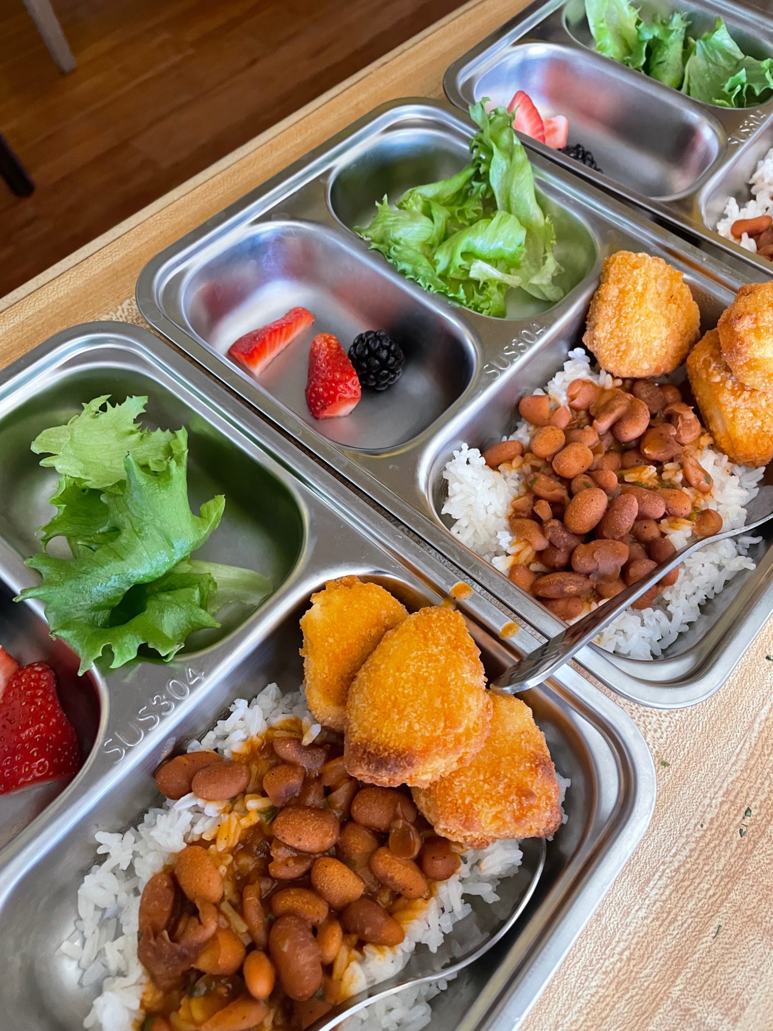 Red beans & rice with chicken served in daycare meal trays