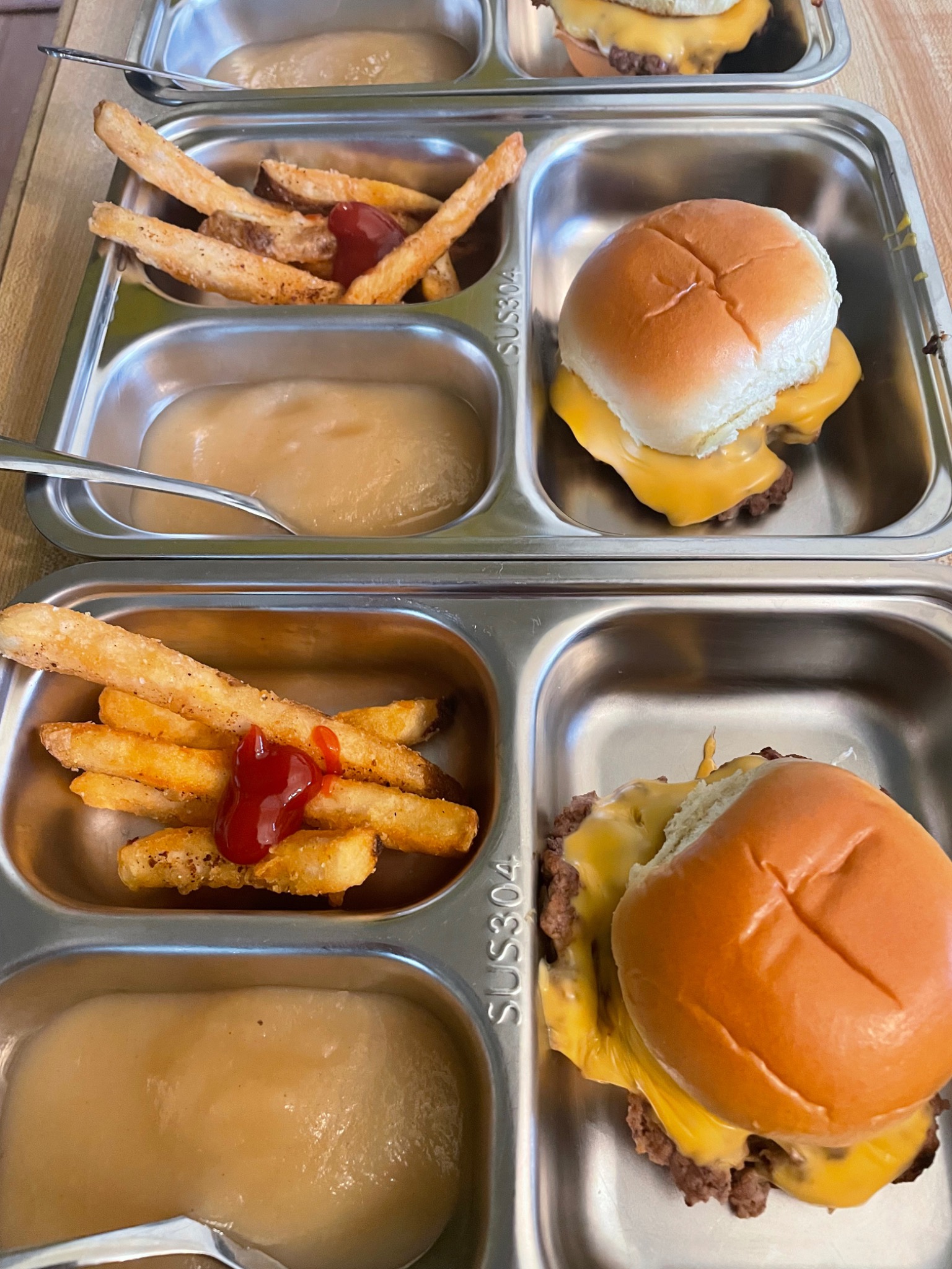 Sliders & fries served in daycare meal trays