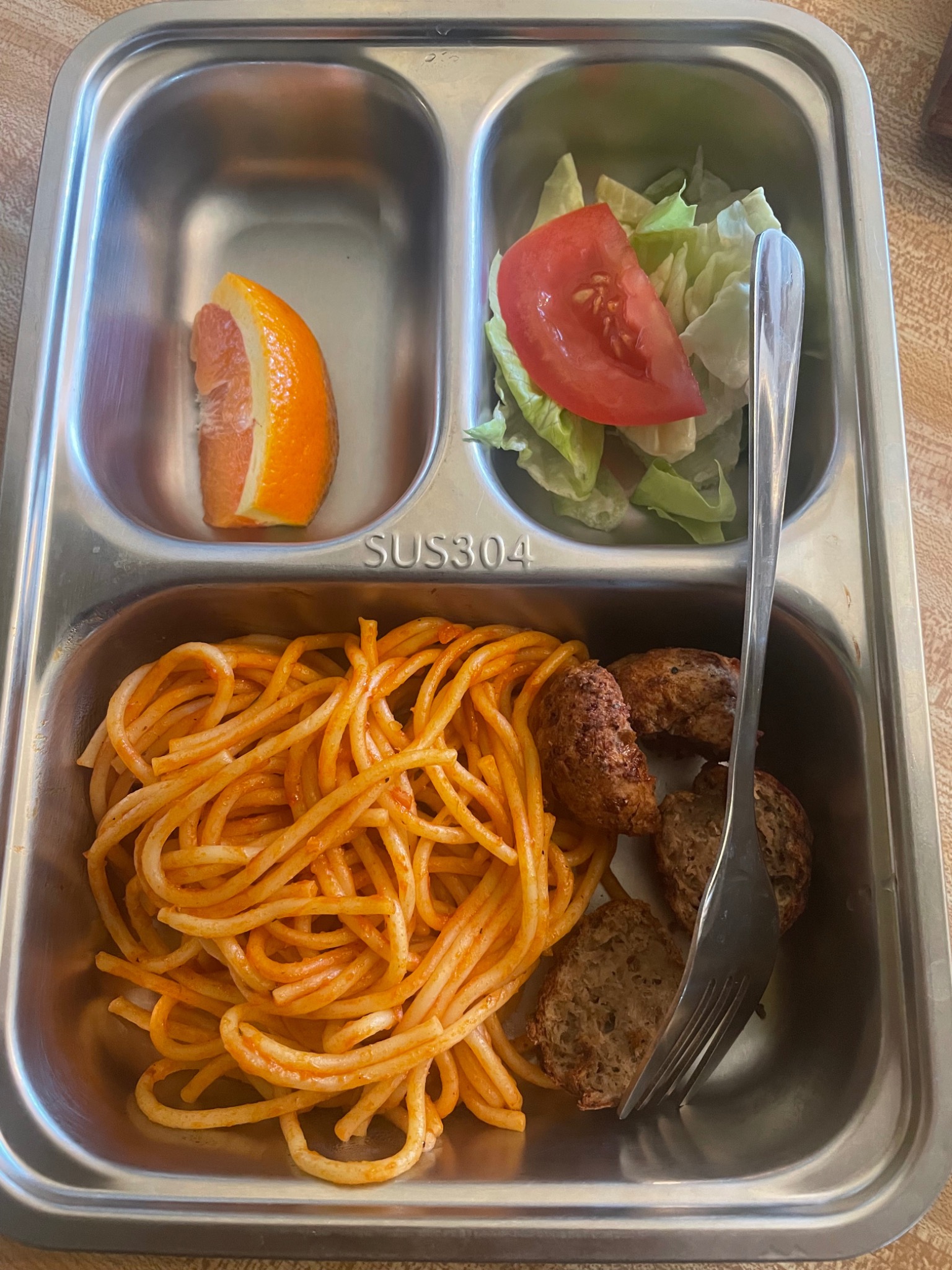 Spanish spaghetti & meatballs served in daycare meal trays